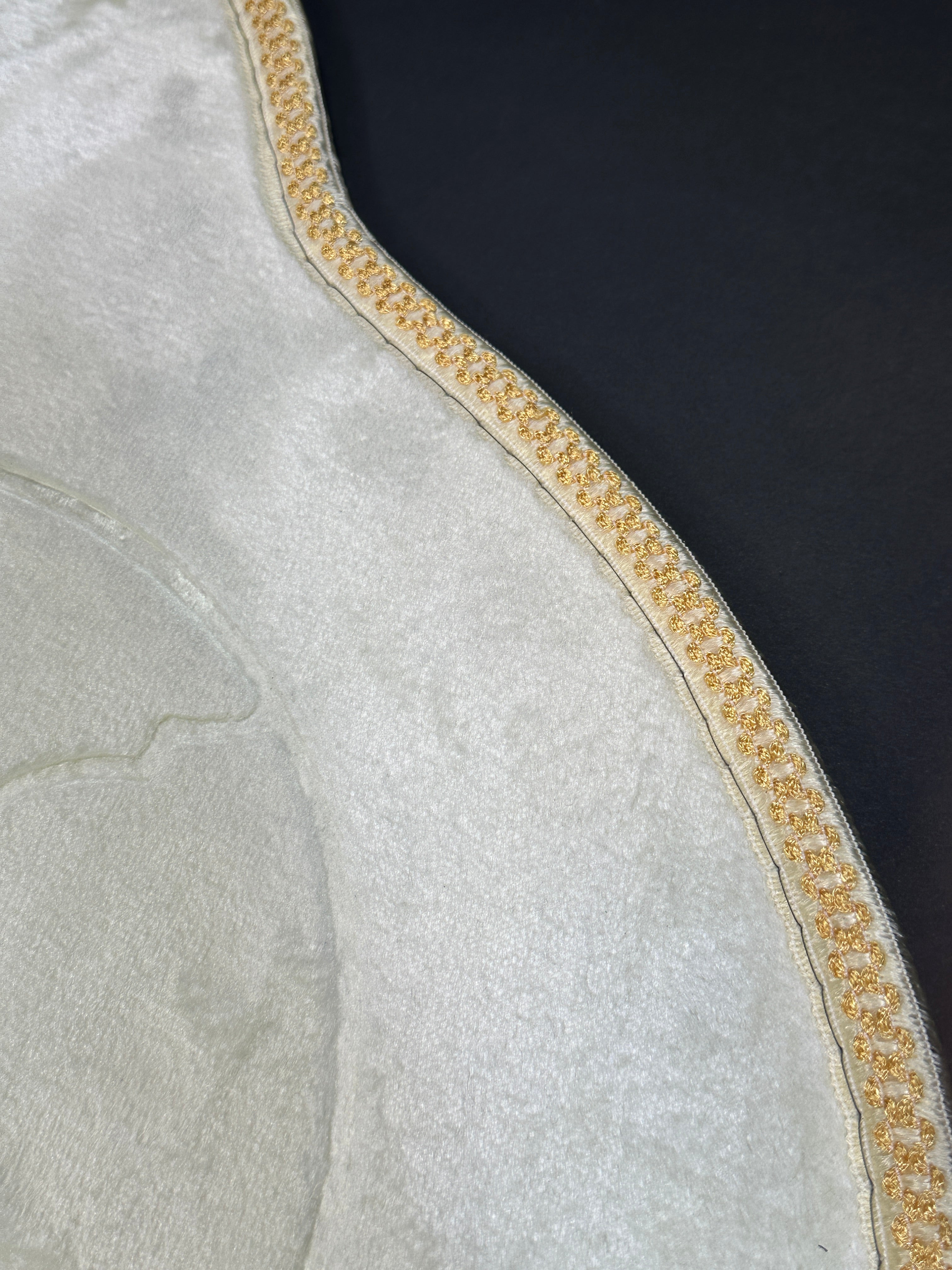 Cream velvet prayer mat up close