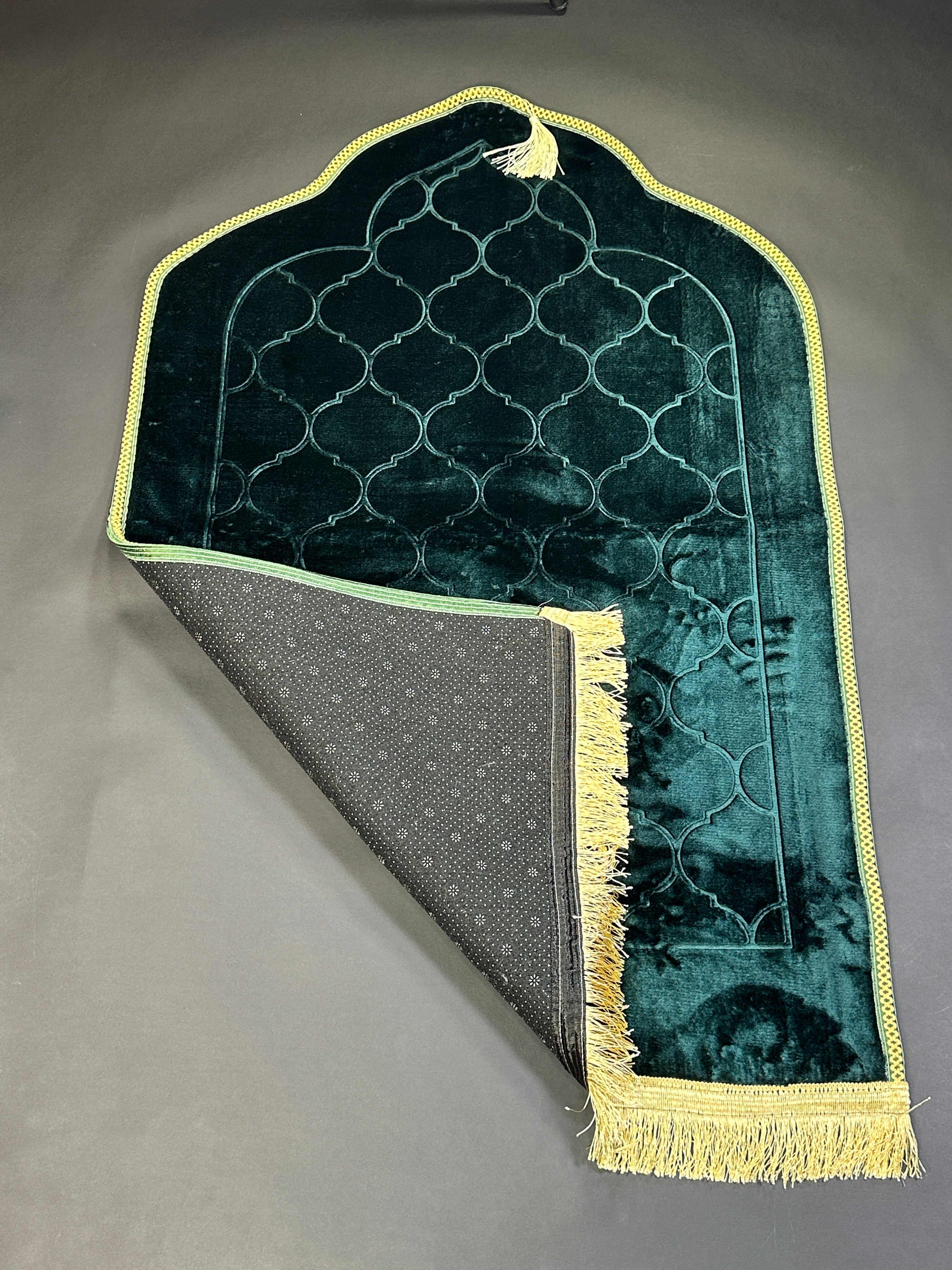 Green velvet prayer mat folded